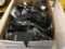 Box of cell phones and cellphone parts