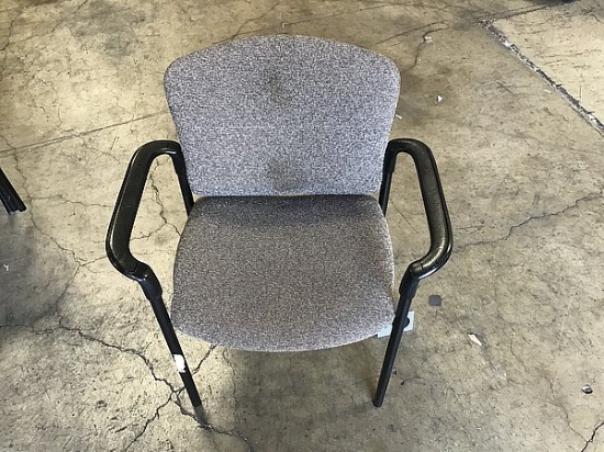 Eight grey office chairs