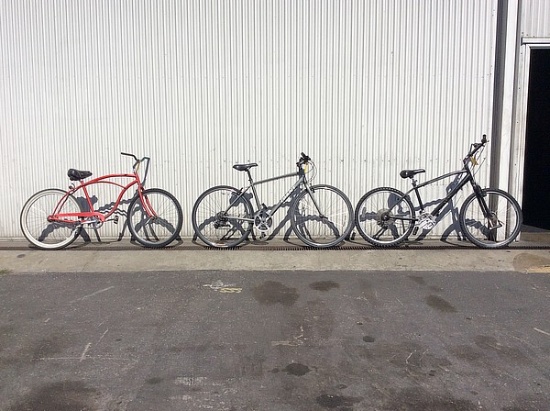 3 bikes, diamondback, giant, no name 1 beach cruiser, 1 road bike, 1 hybrid