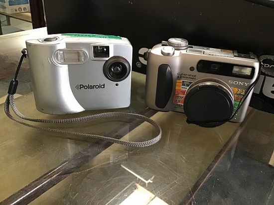 Polaroid camera, soney cyber shot digital camera