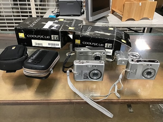 Three Nikon cool pix 1 hp camera