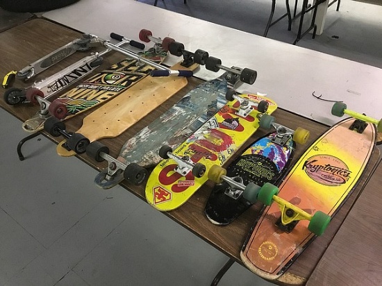 6 skateboards and 2 razor scooters
