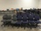 Six grey office chairs with eight blue office chairs