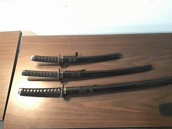 Three black samurai swords