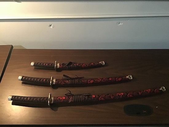 Three red samurai swords