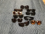 Eleven assorted sunglasses