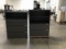 Two grey metal four drawer file cabinets With Keurig coffee maker(parts)
