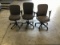 Three grey office chairs