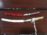 Three samurai display swords