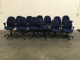 Twelve blue office chairs