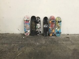 Six assorted skateboards