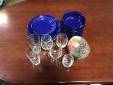 Kitchen glass wear: two cups, three wine glasses, four decorative bowls Eight blue plates and four b