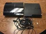 Two PlayStation 3s with cables