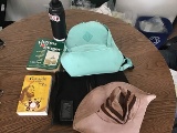 Water jug with hat, two bags with backpack and books