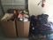 4 Boxes and a pallet of  backpacks, clothes, books, purses, toys