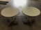 Two white round tables