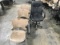 Black office chair with seven brown lobby chairs