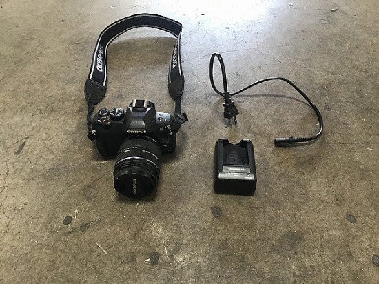 1 Olympus digital camera, 1 charger