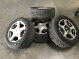 Four Mustang tires with rims
