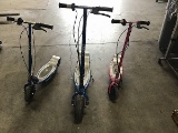 Three razor electric scooters