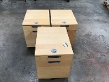 Three wood file cabinets