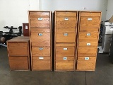 Three four drawer wooden file cabinets and one two drawer wood cabinet