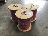 Three rolls of 1000ft each red coated copper wiring