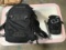 Black bag, black dakine backpack