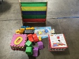 Children book rack with floor puzzle pieces