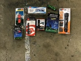 Stun guns, flashlights, mini shovel, sleeping bag