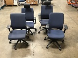 Four blue office chairs