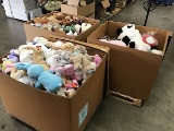 Three boxes of stuffed animals