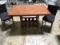 Large wooden dining/kitchen table with two chairs