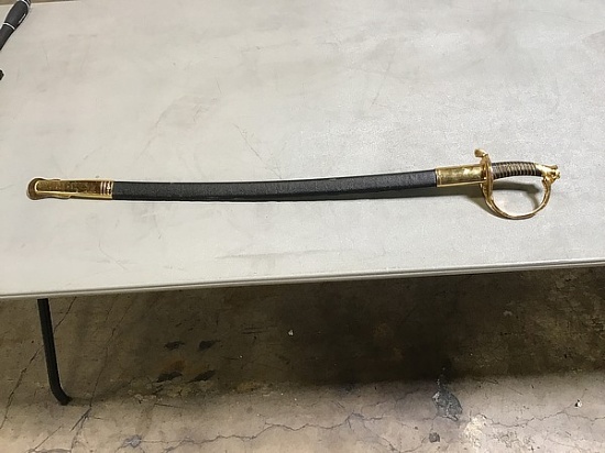 A gold and black USMC sword