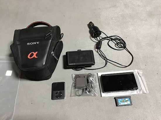 Nintendo video game player with gray charger, 8gb iPod One garmin gps, Sony camera case