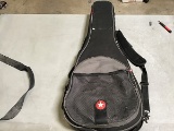 Black guitar case, guitar inside