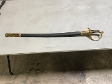 A gold and black USMC sword