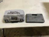 Dremel in gray case, plastic tool container with misc tools