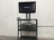 Black tv with tv cart