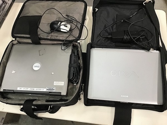 2 laptops with bags Possibly locked, possibly hard drive removed