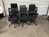 Six black office chairs