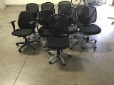 Nine black office chairs