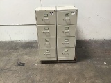 Four four drawer metal file cabinets