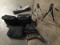 Three camera bags with laptop bag and two tripod stands