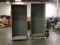 Two tall matal cabinet with shelves