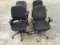 4 black office chairs