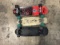 Black skateboard, red/black skateboard, tan skateboard