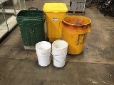 Three trash bins with four small buckets