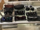 9 pairs of sunglasses and 3 sunglasses cases