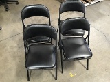 4 black folding chairs